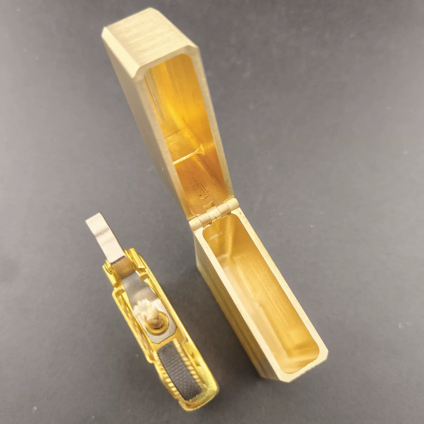 ZORRO Z873 brass lighter shown with inner insert separated from the case